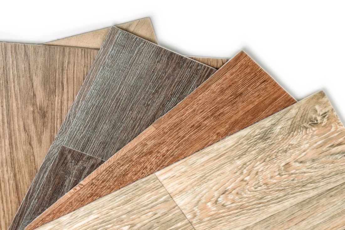 Fan of wood-look flooring plank samples