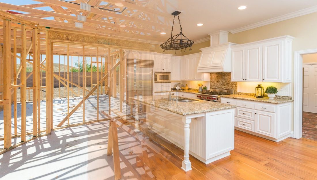Kitchen under construction with cabinet framing in place